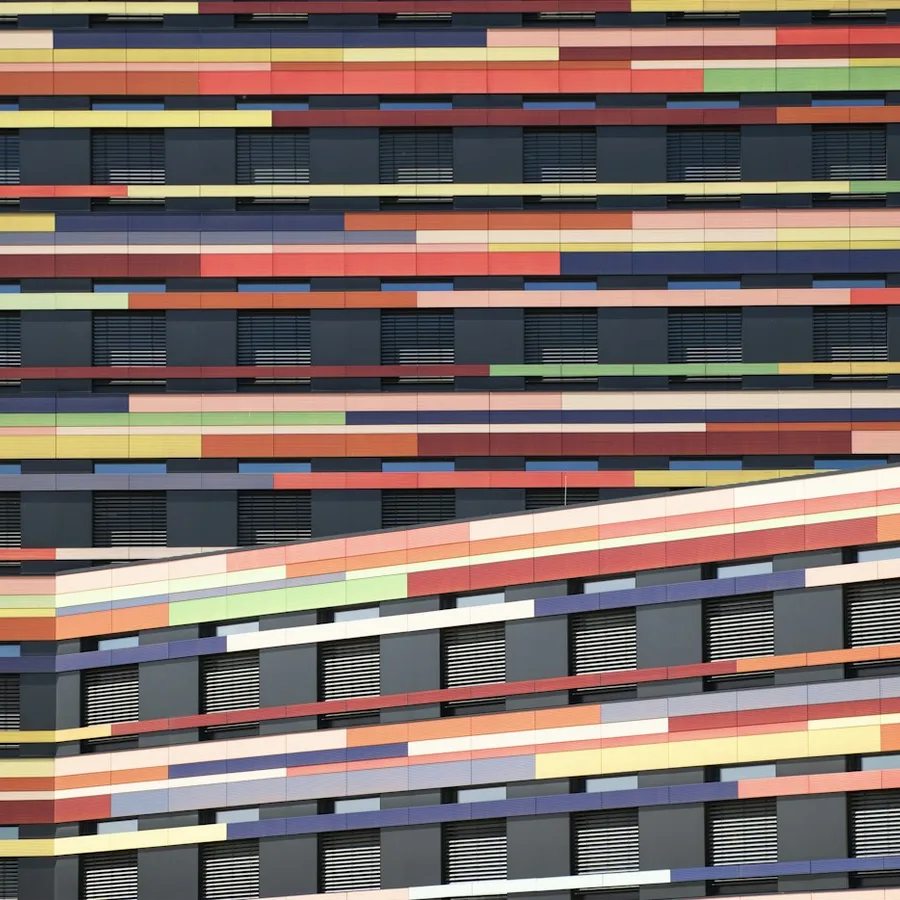A geometric facade with colorful windows